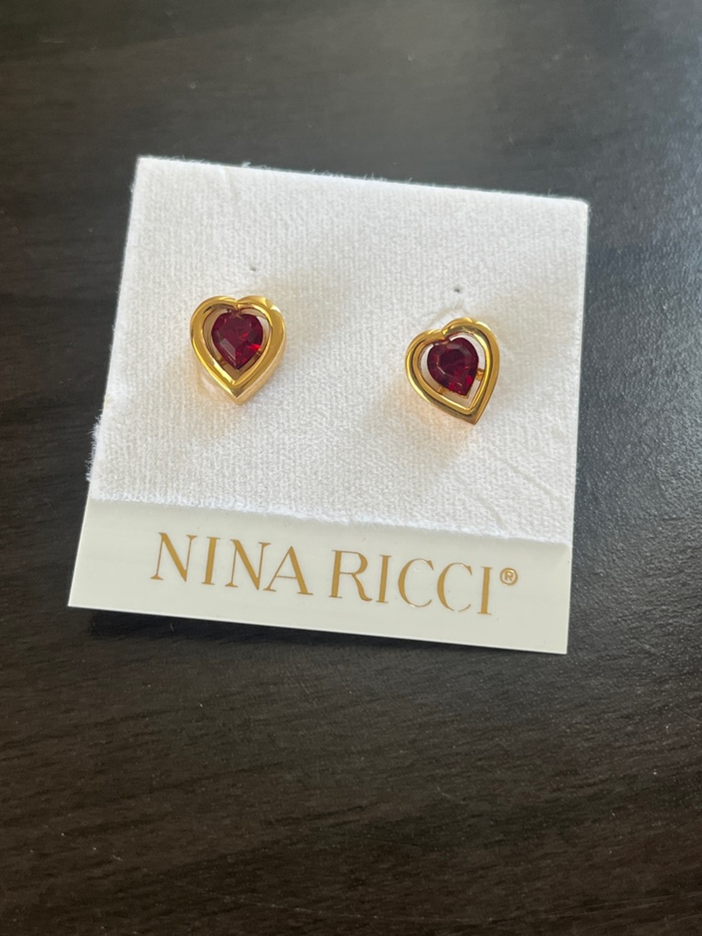 Nina Ricci Gold Heart Stud Earrings with Ruby-Red Center